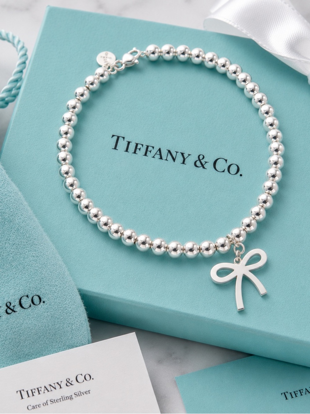 Tiffany & Co. Rare Retired Bow Charm 4mm Bead Bracelet Sterling Silver 7”
